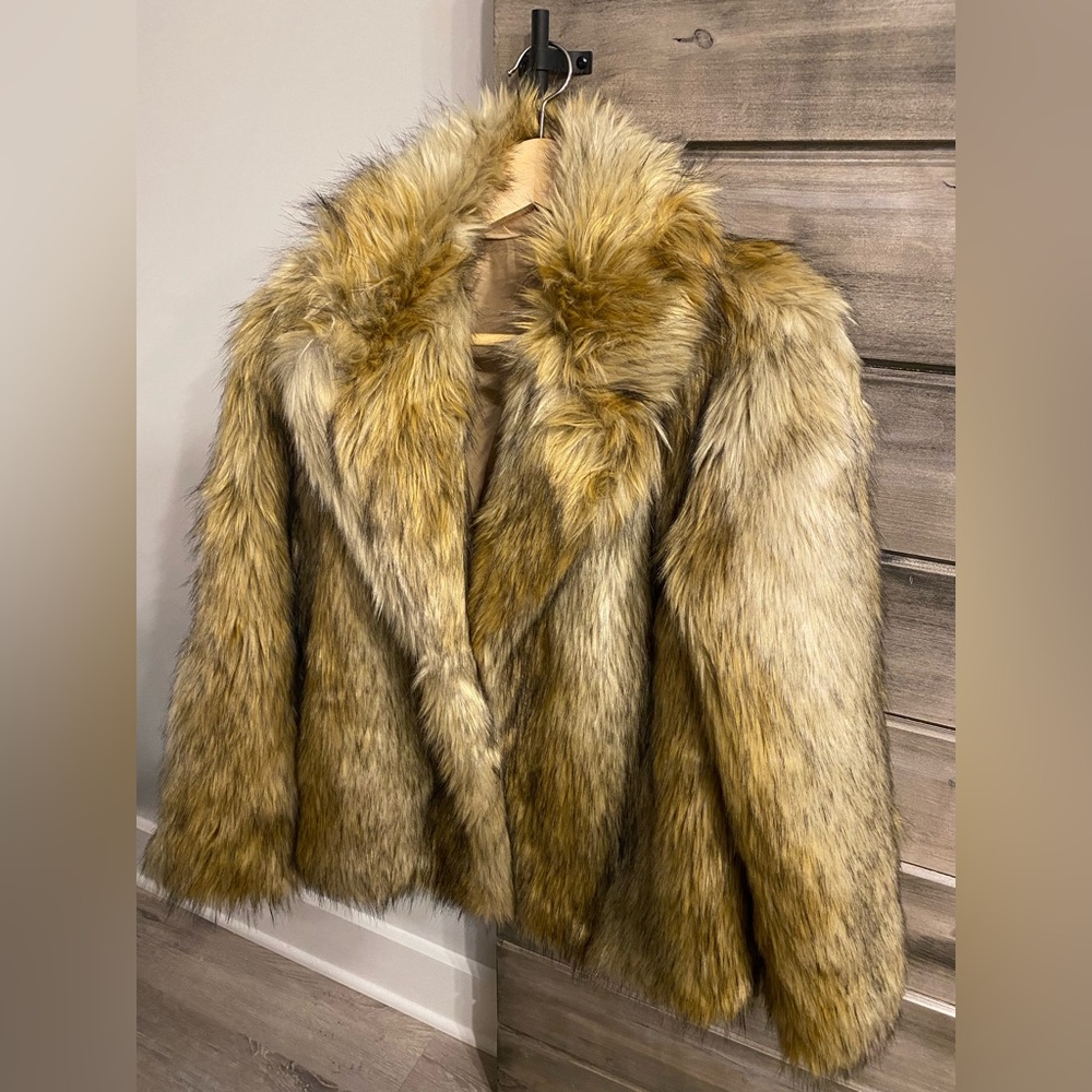 Faux coyote fur jacket from TopShop. Never worn. Fully lined with clasp closure.